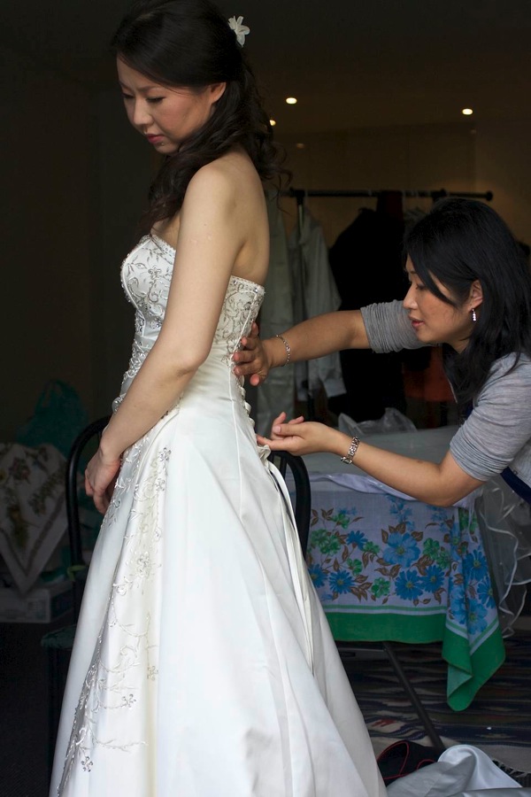 Doing up the wedding dress